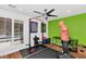 Home gym with a weight rack, punching bag, and wood floors at 6319 E Mariposa St, Scottsdale, AZ 85251