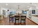 Spacious kitchen boasts a large island with butcher block countertop and white cabinets at 6319 E Mariposa St, Scottsdale, AZ 85251