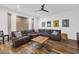 Spacious living room, featuring a sectional sofa and hardwood floors at 6319 E Mariposa St, Scottsdale, AZ 85251