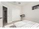 Bedroom with white closet doors and ironing board at 7834 W Forest Grove Ave, Phoenix, AZ 85043