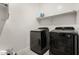 Clean laundry room with front-load washer and dryer at 7834 W Forest Grove Ave, Phoenix, AZ 85043