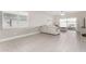 Living room featuring light gray tile floors and a sectional sofa at 7834 W Forest Grove Ave, Phoenix, AZ 85043