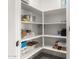 Well-organized pantry with ample shelving for storage at 7834 W Forest Grove Ave, Phoenix, AZ 85043