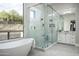 Modern bathroom with large shower, soaking tub, and natural light at 14146 N 106Th Way, Scottsdale, AZ 85255