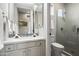 Modern bathroom with a walk-in shower and a floating vanity at 14146 N 106Th Way, Scottsdale, AZ 85255