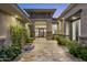 Inviting courtyard entry with stone flooring and water feature at 14146 N 106Th Way, Scottsdale, AZ 85255