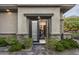 Guest bedroom entrance with private exterior access and stone accents at 14146 N 106Th Way, Scottsdale, AZ 85255