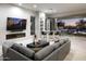 Living room with fireplace, bar, and sliding doors to backyard at 14146 N 106Th Way, Scottsdale, AZ 85255