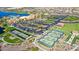 Community amenities including a lake, parking area and sport courts within a Primary-planned neighborhood at 17915 W Silver Fox Way, Goodyear, AZ 85338