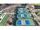 Aerial view of the community pickle ball courts and the surrounding desert landscape at 17915 W Silver Fox Way, Goodyear, AZ 85338