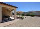 Expansive backyard features low maintenance landscaping, a covered patio and desert landscaping at 17915 W Silver Fox Way, Goodyear, AZ 85338