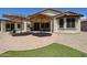 Paver patio and backyard showcasing desert landscaping and great outdoor living space at 17915 W Silver Fox Way, Goodyear, AZ 85338