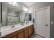 Bathroom boasts double sinks with a large mirror and a separate walk-in shower at 17915 W Silver Fox Way, Goodyear, AZ 85338