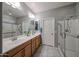 Bathroom boasts double sinks with a large mirror and a separate walk-in shower at 17915 W Silver Fox Way, Goodyear, AZ 85338