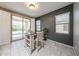 Bright dining area features tile floors, a modern light fixture and views of the backyard at 17915 W Silver Fox Way, Goodyear, AZ 85338