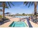 Inviting community hot tub alongside an expansive pool and lush desert landscaping at 17915 W Silver Fox Way, Goodyear, AZ 85338