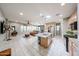 Bright, open kitchen with a granite island, stainless steel appliances, and seamless access to the living room at 17915 W Silver Fox Way, Goodyear, AZ 85338
