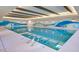 Beautiful indoor pool features custom design and attractive ceiling beam work at 17915 W Silver Fox Way, Goodyear, AZ 85338