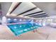 The indoor community pool offers space for swimming laps or relaxing in luxury at 17915 W Silver Fox Way, Goodyear, AZ 85338