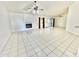 Spacious living room featuring tile flooring and a fireplace at 18024 N 36Th Ln, Glendale, AZ 85308