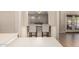 Eat-in kitchen featuring a breakfast bar with pendant lighting at 18174 W Wind Song Ave, Goodyear, AZ 85338