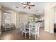 Bright dining room features a table and chairs and built-in storage at 18174 W Wind Song Ave, Goodyear, AZ 85338