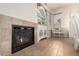 Inviting living room showcasing a fireplace and built-in shelves at 18174 W Wind Song Ave, Goodyear, AZ 85338