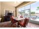 Outdoor patio with a dining area and access to the pool at 18174 W Wind Song Ave, Goodyear, AZ 85338
