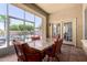 Outdoor patio with a dining area and access to the pool at 18174 W Wind Song Ave, Goodyear, AZ 85338
