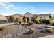 Single-story home with desert landscaping and two-car garage at 20103 N 265Th Ave, Buckeye, AZ 85396