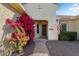 Front entry with vibrant bougainvillea and a brick walkway at 20103 N 265Th Ave, Buckeye, AZ 85396