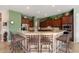 Large kitchen with granite countertops and dark wood cabinets at 20103 N 265Th Ave, Buckeye, AZ 85396