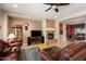 Open living room featuring a fireplace and built-in shelving at 20103 N 265Th Ave, Buckeye, AZ 85396