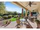 Covered patio with seating area, ceiling fans, and a view of the backyard at 20103 N 265Th Ave, Buckeye, AZ 85396