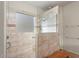 Walk-in shower with built-in seat and tiled walls at 20103 N 265Th Ave, Buckeye, AZ 85396