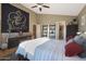 Spacious bedroom with large art piece and ensuite bathroom access at 2237 E Nicolet Ave, Phoenix, AZ 85020