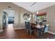 Modern dining area with sleek table and chairs, hardwood floors, and natural light at 2237 E Nicolet Ave, Phoenix, AZ 85020