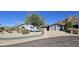 Single-story home with gray exterior, two-car garage, and landscaped yard at 2237 E Nicolet Ave, Phoenix, AZ 85020