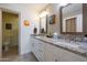 Double vanity bathroom with granite countertop and updated fixtures at 2237 E Nicolet Ave, Phoenix, AZ 85020