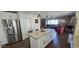 Modern kitchen island with seating, stainless steel appliances and an open layout at 2237 E Nicolet Ave, Phoenix, AZ 85020