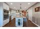 Stylish kitchen featuring granite island, stainless steel appliances, and white cabinetry at 2237 E Nicolet Ave, Phoenix, AZ 85020