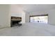 Spacious living room with fireplace and sliding doors leading to backyard at 23002 N Country Club Trl Trl, Scottsdale, AZ 85255