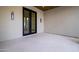 Covered patio showcasing tile flooring and double glass doors for indoor-outdoor living at 23002 N Country Club Trl Trl, Scottsdale, AZ 85255