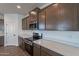 Modern kitchen with stainless steel appliances and ample cabinetry at 24144 W Gibson Ln, Buckeye, AZ 85326