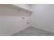 Laundry area with built in shelving and hookups at 24144 W Gibson Ln, Buckeye, AZ 85326