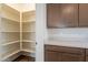 Walk-in pantry with ample shelving for storage at 24144 W Gibson Ln, Buckeye, AZ 85326