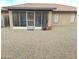 Screened patio with fire pit and gravel yard at 7829 E Naranja Ave, Mesa, AZ 85209