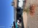 View of a backyard featuring gravel, patio with furniture, and a solar panel roof at 10443 W Butler Dr, Peoria, AZ 85345