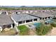 Aerial view of house, pool, and backyard in a residential neighborhood at 13487 W Roy Rogers Rd, Peoria, AZ 85383