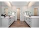 Elegant bathroom with double vanities and a shared toilet area at 13487 W Roy Rogers Rd, Peoria, AZ 85383